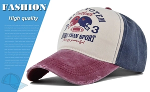Detail of washed distressed baseball cap showing torn brim and multicolor tricolor panels