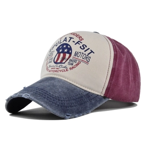Detail of distressed denim brim and American retro shield print on a moto cap