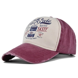 Detail of distressed vintage graffiti baseball cap with contrast stitching and worn edge
