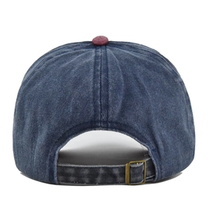 Detail of vintage washed denim baseball cap back with adjustable metal buckle strap