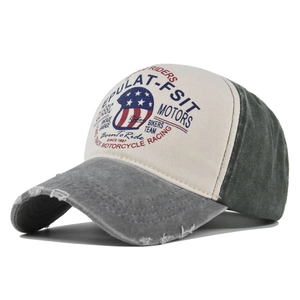 Detailed macro view of retro moto graffiti print and distressed edges on the baseball cap