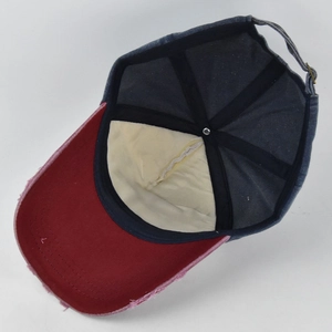 Detail view of the vintage distressed baseball cap interior with reinforced stitching