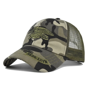 Detailed embroidery of Navy SEAL insignia on camouflage breathable mesh trucker hat