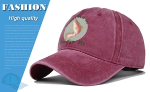 Detailed view of washed red vintage baseball cap with a colorful fish graphic and slogan