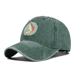 Detail of green washed cotton baseball cap with fish print and funny slogan