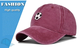 Detailed close-up of a burgundy washed cotton baseball cap with embroidered football patch