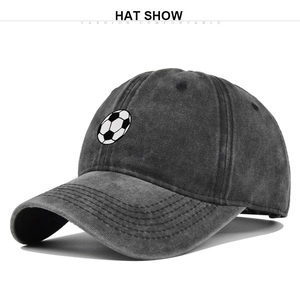 Detailed view of washed charcoal cotton baseball cap with football print and pre-curved brim