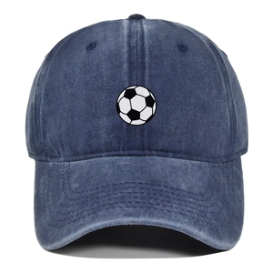 Detailed view of the soccer ball print on the navy blue distressed baseball cap fabric
