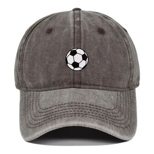 Detailed view of football print on a vintage washed grey cotton baseball trucker hat