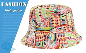 Close-up of a colorful bucket hat with vibrant tropical pineapple and leaf patterns