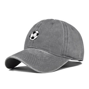 Detailed close-up of distressed charcoal grey baseball cap with embroidered soccer ball