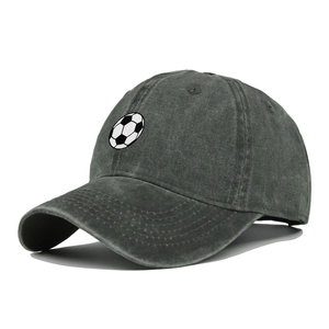 Detail of vintage washed dark gray baseball cap with soccer ball embroidery on front