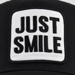 Black breathable mesh baseball cap with JUST SMILE embroidery on the front panel
