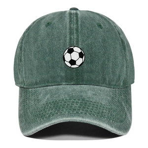 Detail of washed green denim baseball cap featuring high-quality football pattern embroidery