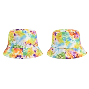 Detailed view of colorful tie-dye bucket hat with hand-drawn white graffiti pattern