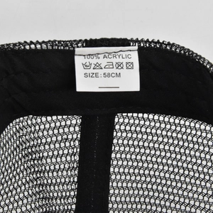 Detail shot of mesh baseball cap washing label showing 100% acrylic material and 58cm size