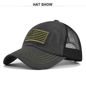 Detail of grey baseball cap showing black mesh back and olive green American flag patch