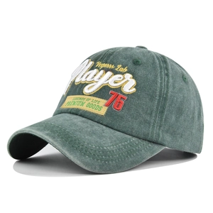 Detailed macro view of retro green washed cotton baseball cap with 3D Player embroidery
