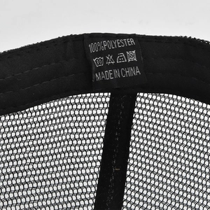 Detail shot of the 100% polyester label and internal mesh stitching on black army cap