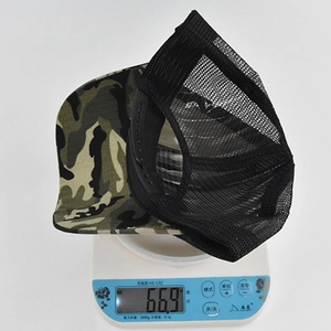 Macro detail of camouflage baseball cap showing lightweight breathable mesh weighing 66.9g