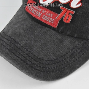 Macro detail of vintage washed cotton cap with 3D number 76 and premium embroidery