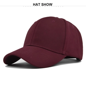 Detail view of burgundy baseball cap featuring six-panel construction and embroidered eyelets