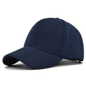 Detailed close-up of a navy blue six-panel baseball cap with curved brim and ventilation eyelets