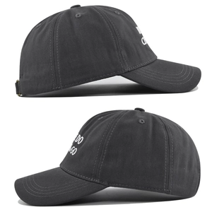 Detail view of charcoal grey washed cotton baseball cap featuring side text embroidery