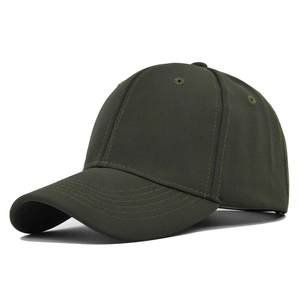 Close-up detail of a dark green twill canvas baseball cap with reinforced stitching
