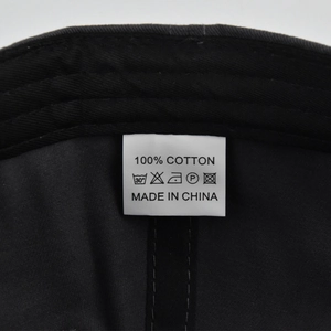 Detail shot of the cotton twill interior with a wash care label showing 100% cotton fabric