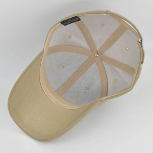Detail view of khaki baseball cap interior showing sweatband and reinforced stitching
