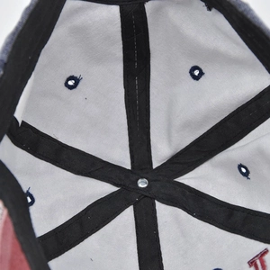 Detail of internal crown construction on washed baseball cap with reinforced black seams