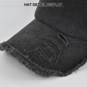 Distressed dark grey washed denim baseball cap with worn-out brim and frayed edge details