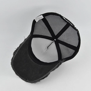 Close-up of vintage trucker hat interior showing breathable mesh and washed cotton fabric