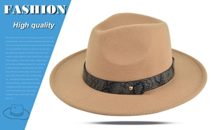 Detail of khaki fedora hat with snakeskin leather band and gold metal rivet embellishment