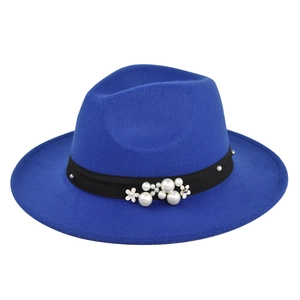 Detail of royal blue fedora hat with black ribbon featuring pearls and floral accents