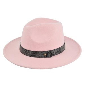 Close-up of pink wool fedora hat featuring a gray snakeskin band with golden stud detail