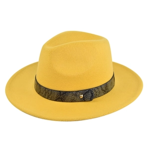 Detailed macro view of yellow wool felt fedora with snake print band and golden metal stud