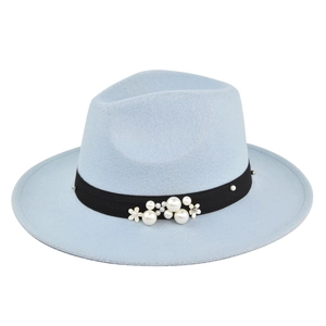 Close-up of light blue wool fedora hat featuring black ribbon with pearls and white flowers