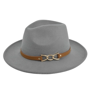 Detail view of grey felt fedora featuring brown leather band and gold metal chain buckle