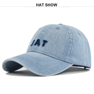 Detail of light blue denim baseball cap showing premium 3D JAT embroidery and distressed brim