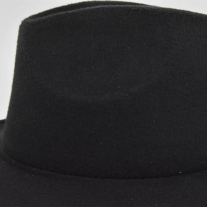 Detailed close-up showing the fine stitching and wool felt texture of the black jazz hat