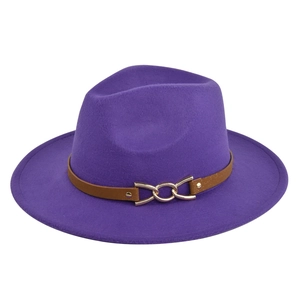Detail of purple wide brim fedora hat featuring brown leather belt and gold chain buckle