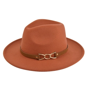 Detail of brick red fedora hat with brown leather band and gold metal chain buckle