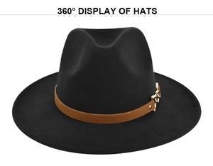Detailed close-up of a black wide-brim fedora hat with a brown leather band and gold metal chain