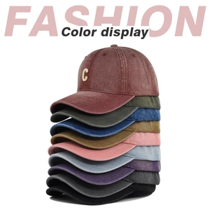 Vertical stack of washed cotton baseball caps in nine colors with C embroidery detail