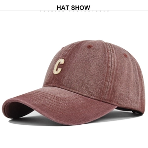 Close-up of the vintage burgundy washed denim baseball cap with beige letter C embroidery