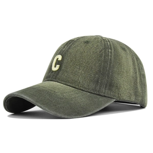 Close-up of olive green vintage washed denim baseball cap with C letter embroidery