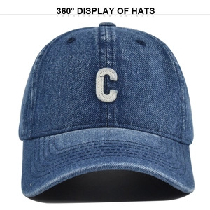 Detailed view of the vintage washed denim cap with white C letter embroidery and stitching