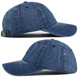 Detail view of washed denim baseball cap featuring vintage buckle and contrast stitching